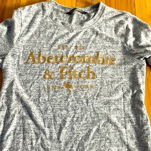 Grey abercrombie shirt with gold lettering